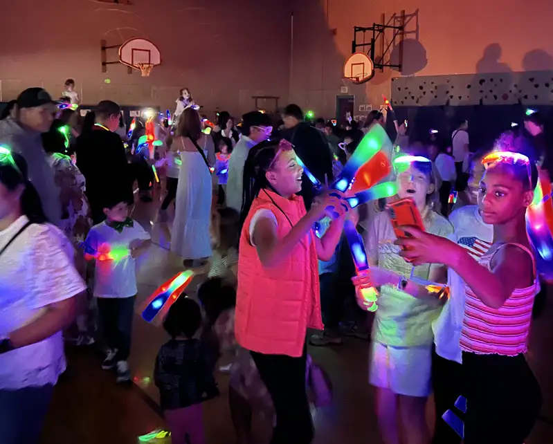 group of kids dancing at a dance